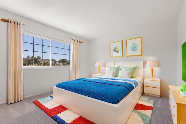 carpeted bedroom featuring baseboards