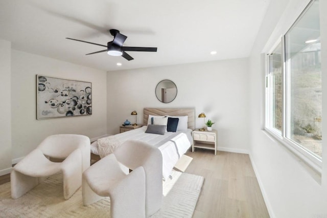 bedroom featuring light wood-style flooring, baseboards, ceiling fan, and recessed lighting