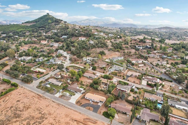 drone / aerial view featuring a residential view and a mountain view