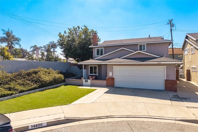 traditional home with brick siding, fence, a garage, driveway, and a front lawn