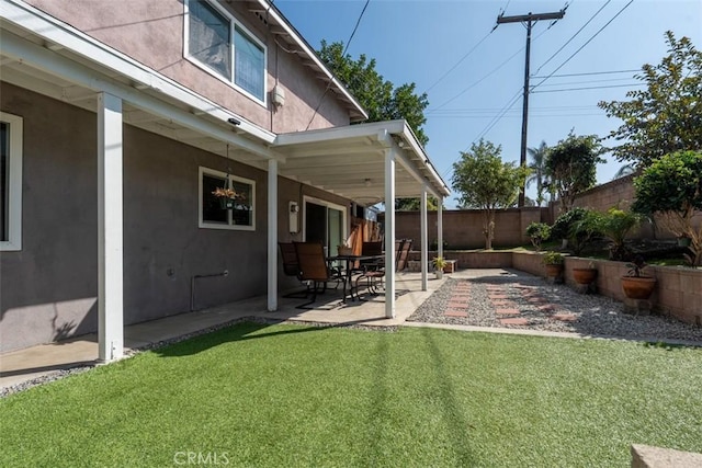 view of yard with a fenced backyard and a patio