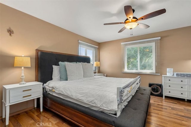 bedroom featuring a ceiling fan and wood finished floors