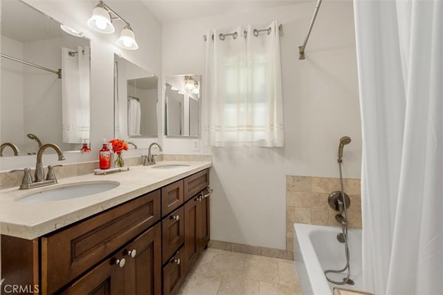 full bathroom featuring tile patterned flooring, double vanity, a sink, and a bath