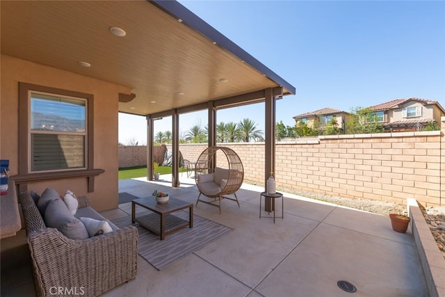 view of patio featuring a fenced backyard and an outdoor living space