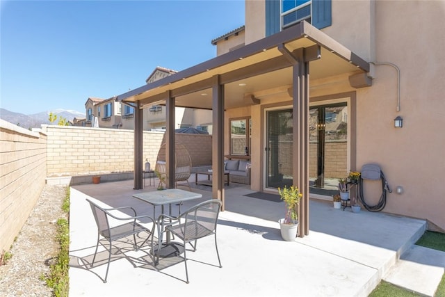 view of patio with a fenced backyard and a mountain view