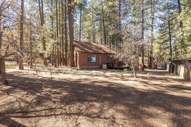 view of side of property with a wooden deck