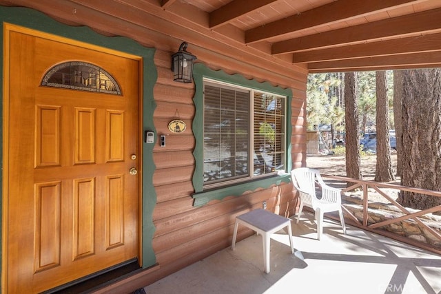 doorway to property with covered porch