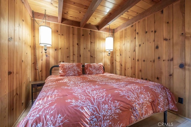 bedroom with wooden ceiling, wood finished floors, beam ceiling, and wood walls