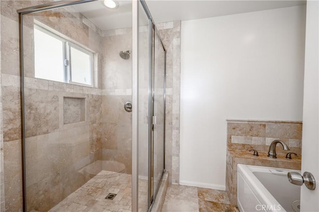 full bathroom featuring a shower stall, baseboards, and a bath