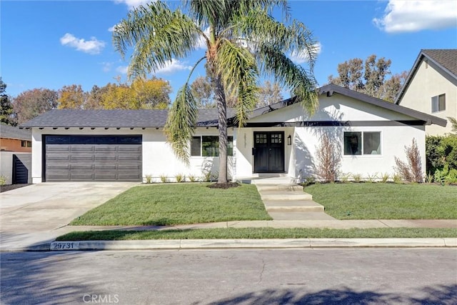 ranch-style house featuring a garage, a front lawn, concrete driveway, and stucco siding