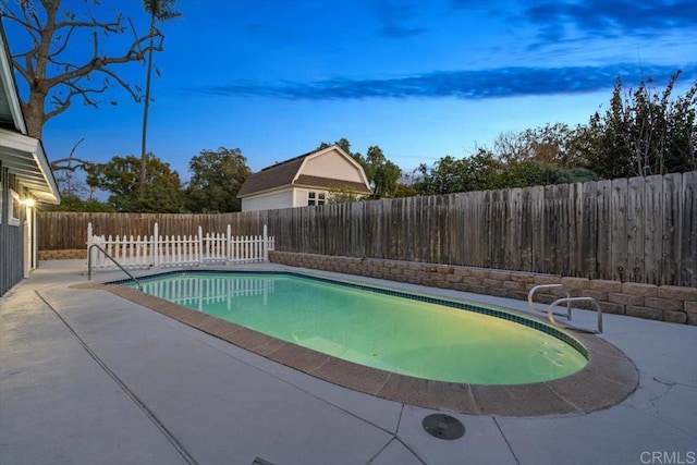 view of swimming pool with a fenced in pool, a patio area, and a fenced backyard
