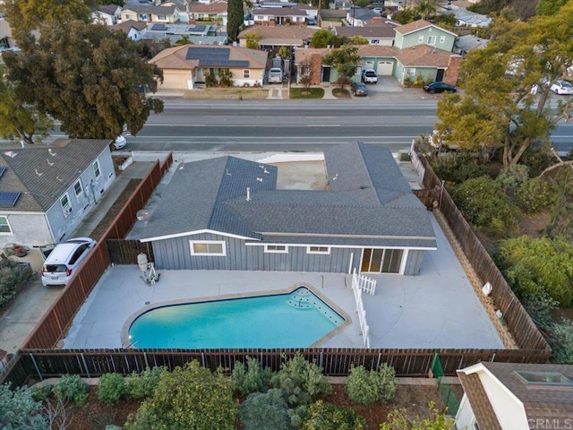 exterior space with a residential view, a patio, and a fenced backyard