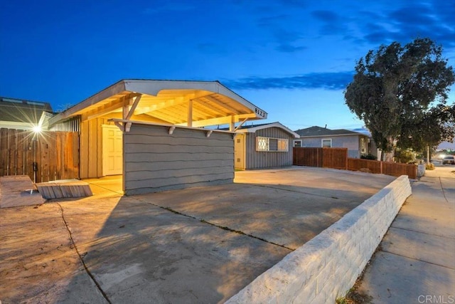 ranch-style house with fence