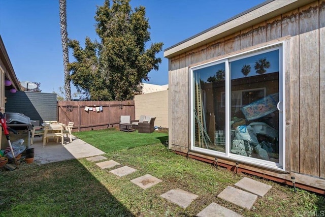 view of yard featuring a patio and fence