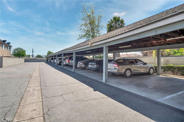 covered parking lot with fence