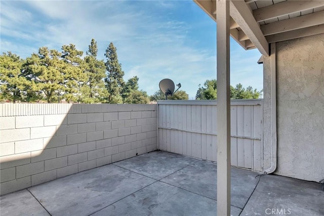 view of patio / terrace featuring fence