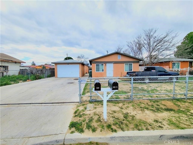 ranch-style home with a fenced front yard, an outbuilding, driveway, and stucco siding