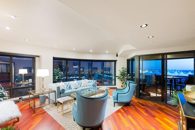 living room with wood finished floors and recessed lighting