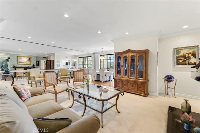 living room featuring light carpet, baseboards, ornamental molding, and recessed lighting