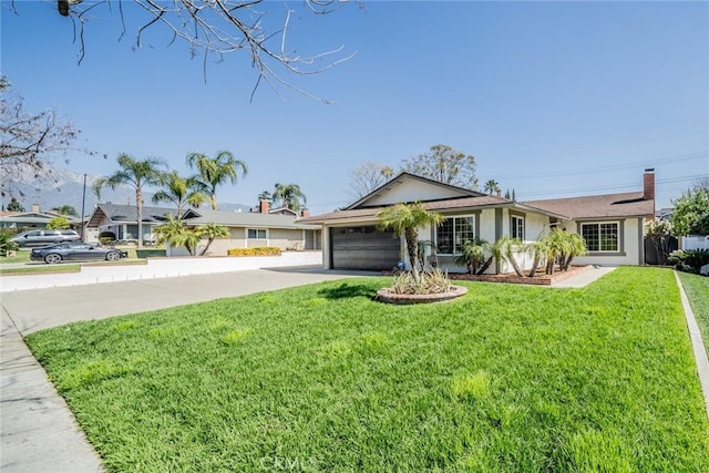 ranch-style home with driveway, stucco siding, an attached garage, and a front yard