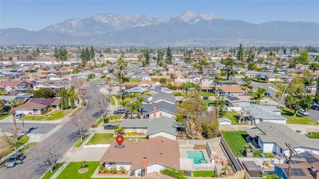 drone / aerial view featuring a residential view and a mountain view