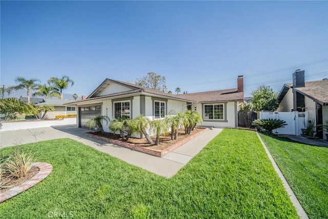 ranch-style home featuring a front lawn, an attached garage, fence, and stucco siding