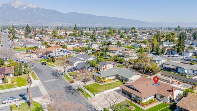 aerial view featuring a mountain view and a residential view