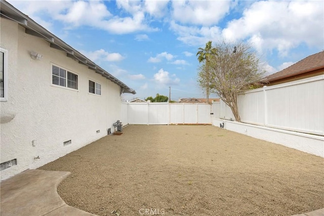 view of yard with a patio area and a fenced backyard