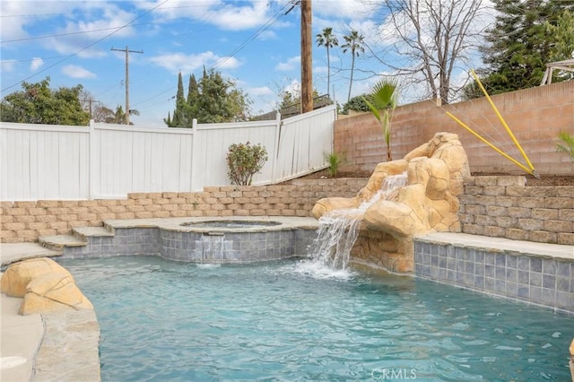 view of pool featuring a fenced in pool, a fenced backyard, and an in ground hot tub