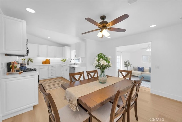 dining area with lofted ceiling, recessed lighting, baseboards, and light wood-style floors