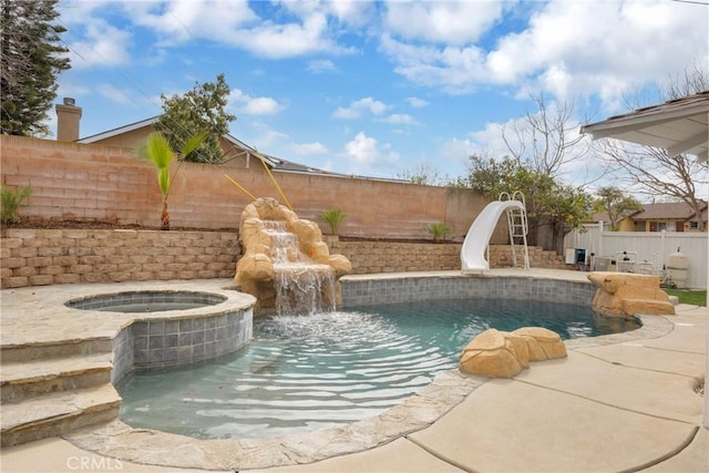 view of swimming pool with a fenced in pool, a water slide, a fenced backyard, and an in ground hot tub