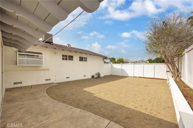 view of yard featuring a patio area and a fenced backyard