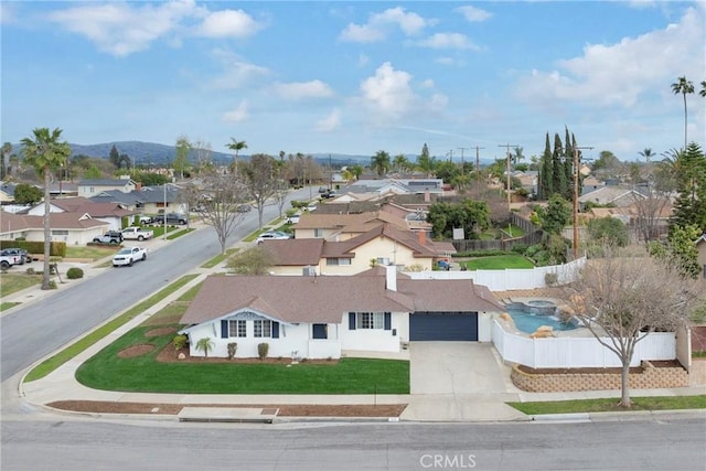 birds eye view of property with a residential view