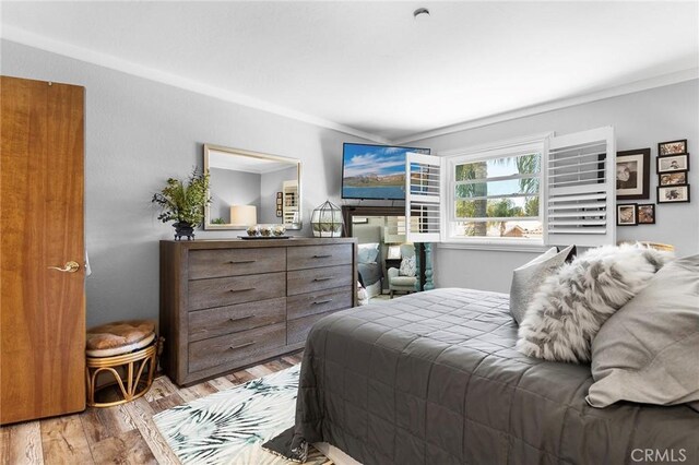 22570 Bass Pl Unit 7, Canyon Lake, CA 92587 - bedroom featuring crown molding and wood finished floors