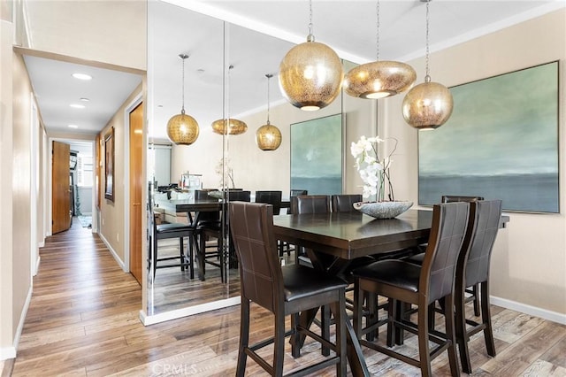 dining room with wood finished floors and baseboards