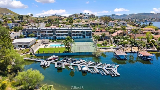 aerial view featuring a water and mountain view