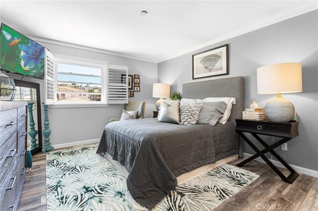 22570 Bass Pl Unit 7, Canyon Lake, CA 92587 - bedroom with baseboards and wood finished floors