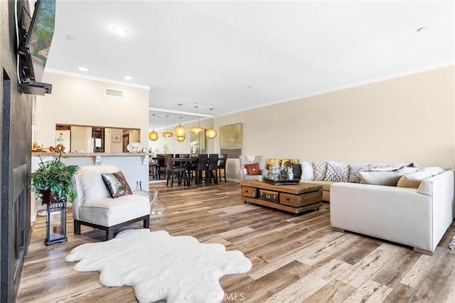 22570 Bass Pl Unit 7, Canyon Lake, CA 92587 - living room with recessed lighting, wood finished floors, visible vents, and ornamental molding