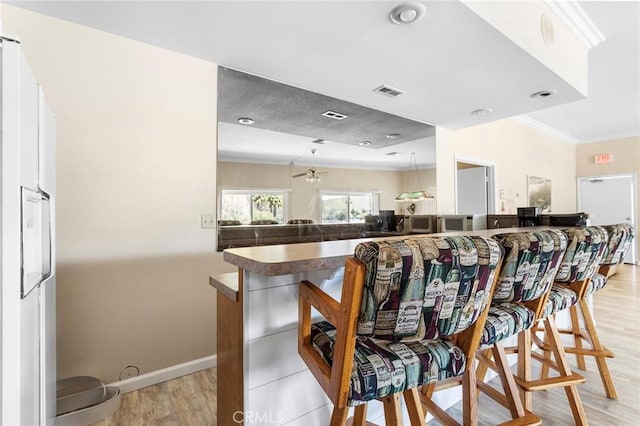22570 Bass Pl Unit 7, Canyon Lake, CA 92587 - interior space featuring light wood finished floors, visible vents, ceiling fan, and baseboards