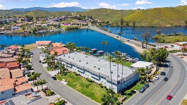 drone / aerial view with a water and mountain view