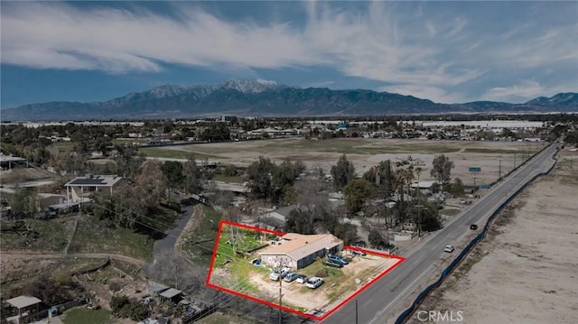 birds eye view of property featuring a mountain view