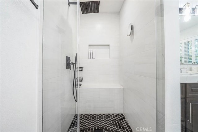 full bath featuring a stall shower and vanity