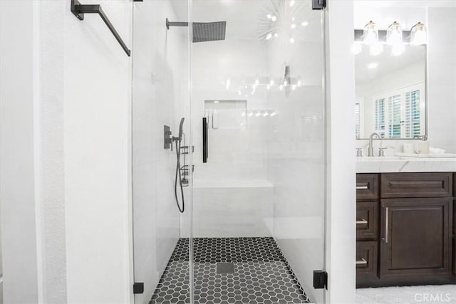 full bath featuring a stall shower and vanity