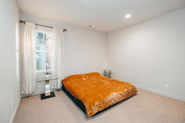 bedroom with recessed lighting, light carpet, visible vents, and baseboards