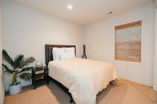 carpeted bedroom with baseboards, visible vents, and recessed lighting