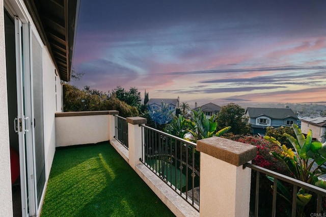 view of balcony at dusk