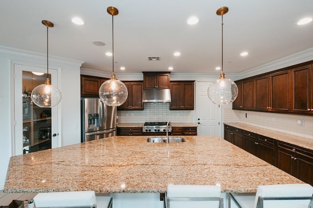 kitchen with visible vents, stainless steel fridge with ice dispenser, dark brown cabinets, under cabinet range hood, and a sink