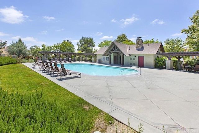 pool with a yard, a pergola, and a patio