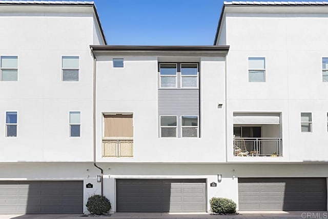 exterior space with driveway and an attached garage