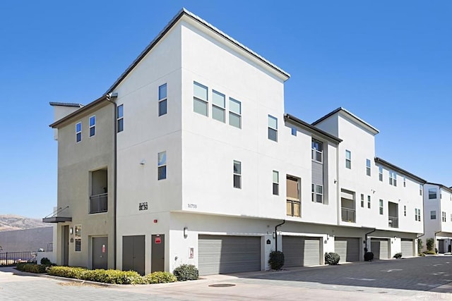 view of building exterior featuring an attached garage